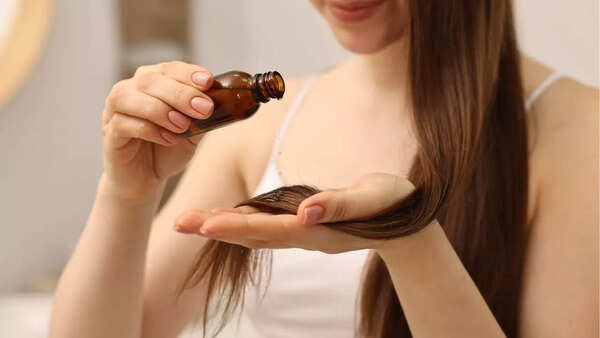 Woman massaging oil into her scalp
