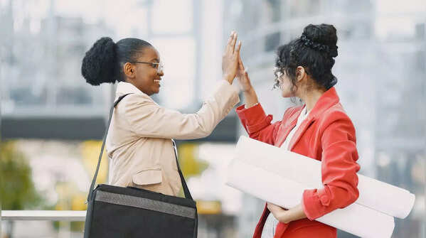 Confident woman celebrating a friend's success.