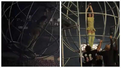 Katy Perry on a tilting metal sphere during her concert.
